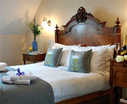 Comfy french antique double bed with cool cotton sheets and ensuite bedroom